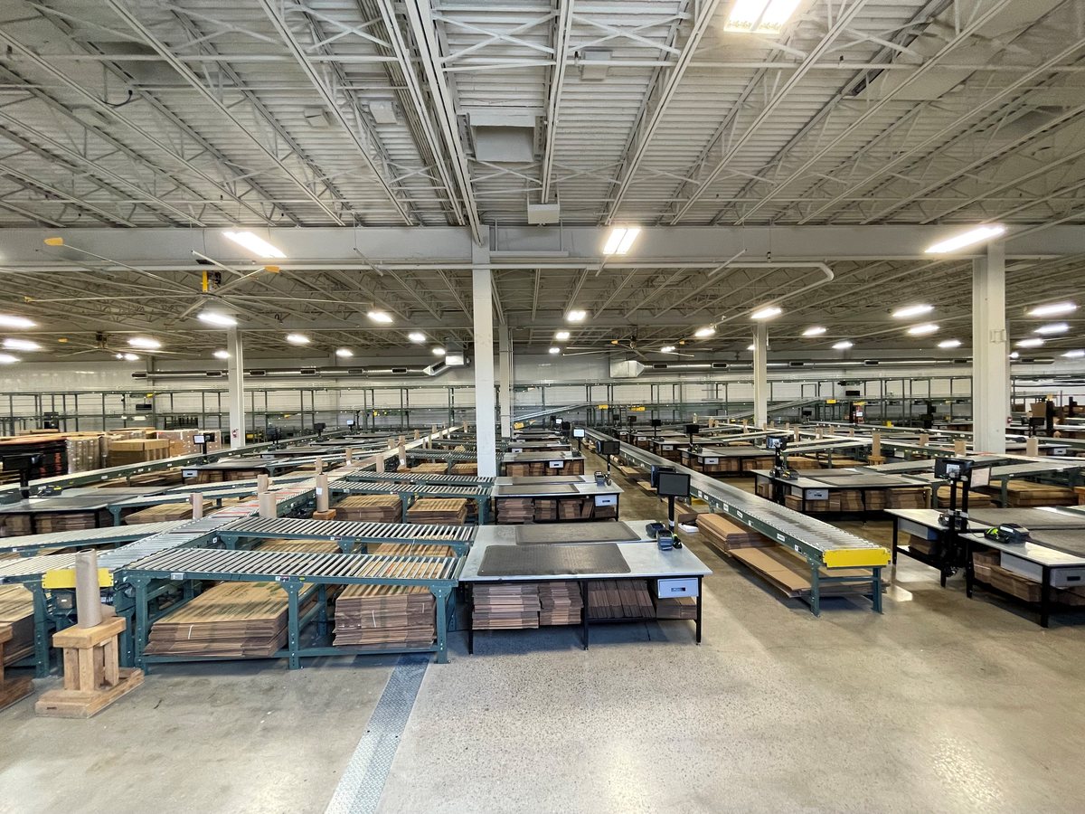 Rows of pack-out stations in fulfillment systems